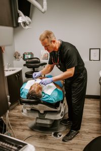 Madison dentist working with patient